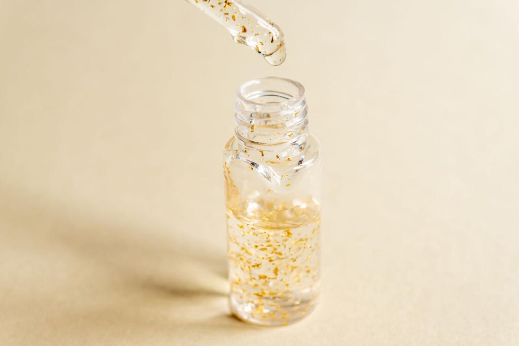Premium hyaluronic glow serum in a sleek dropper bottle with a glossy texture